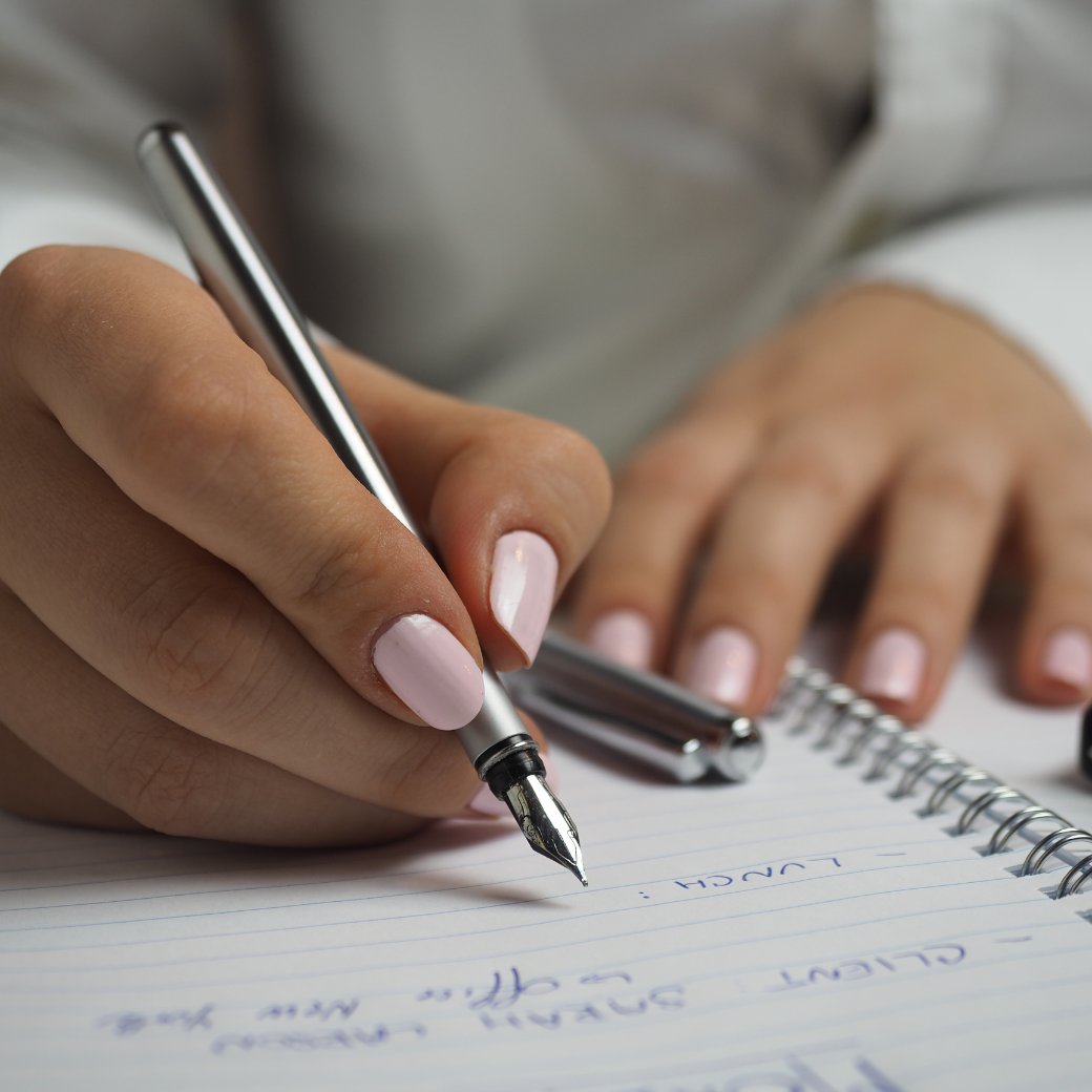 woman writing her business plan